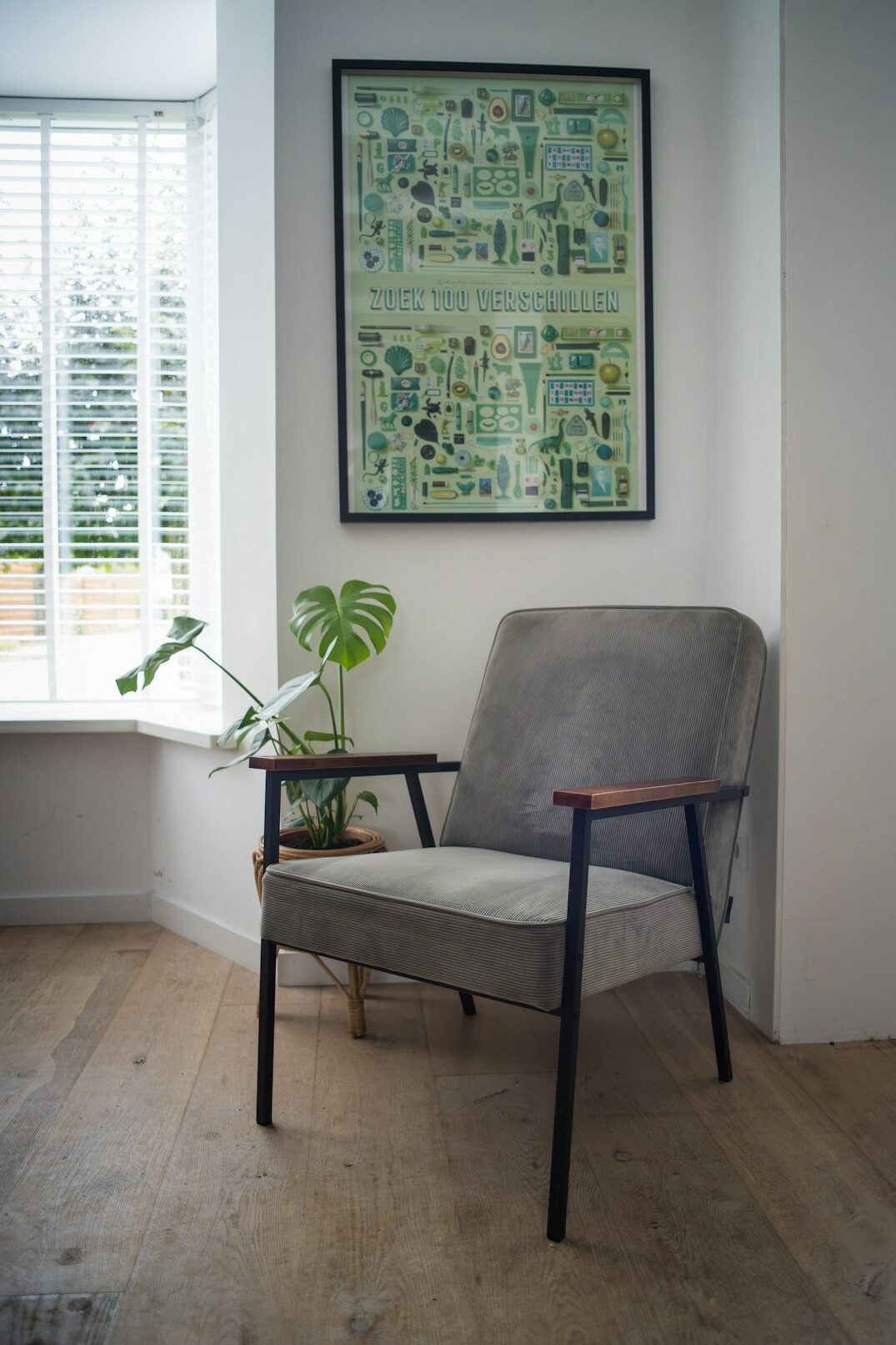Bright reading room with an armchair, a side table and a large window